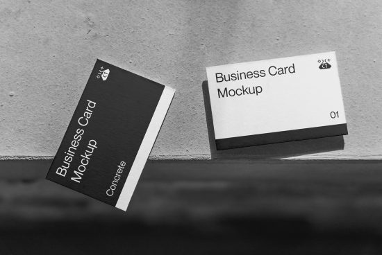 Black and white business card mockups with elegant design on a textured surface, ideal for professional branding presentations.